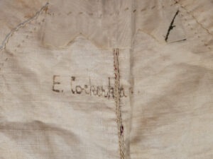 A signature reading 'E Cockerham' inside the bodice of the 18th century silk gown